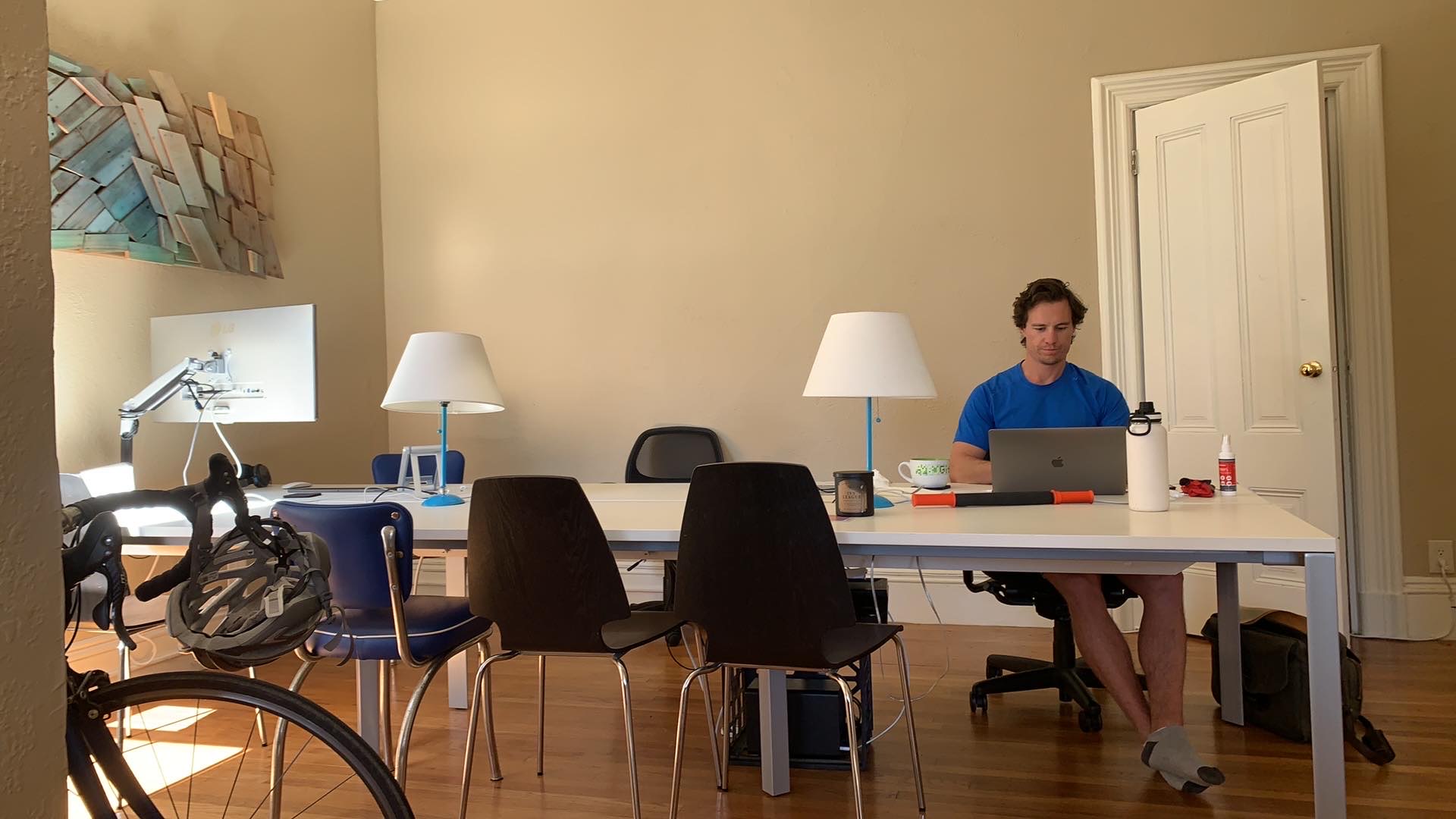 Bright coworking space with large desk and professional setup
