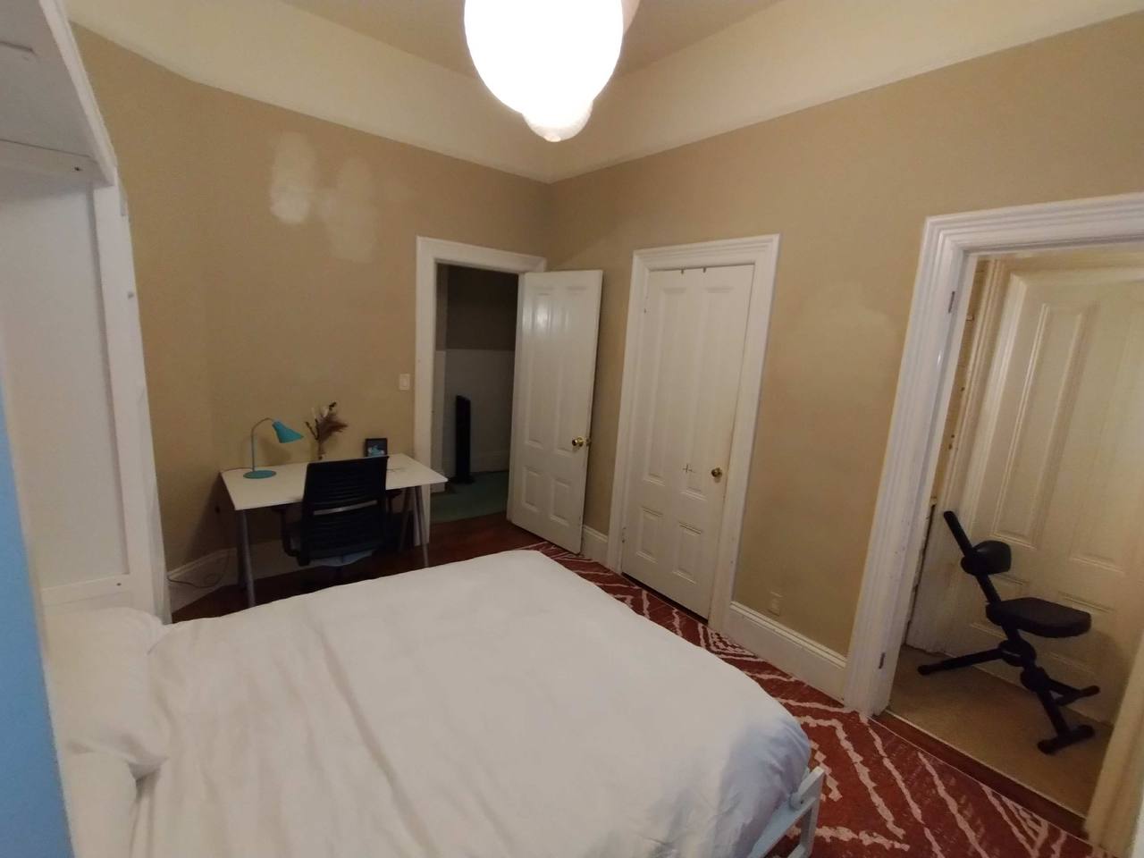 Murphy bed room view from bed toward desk area